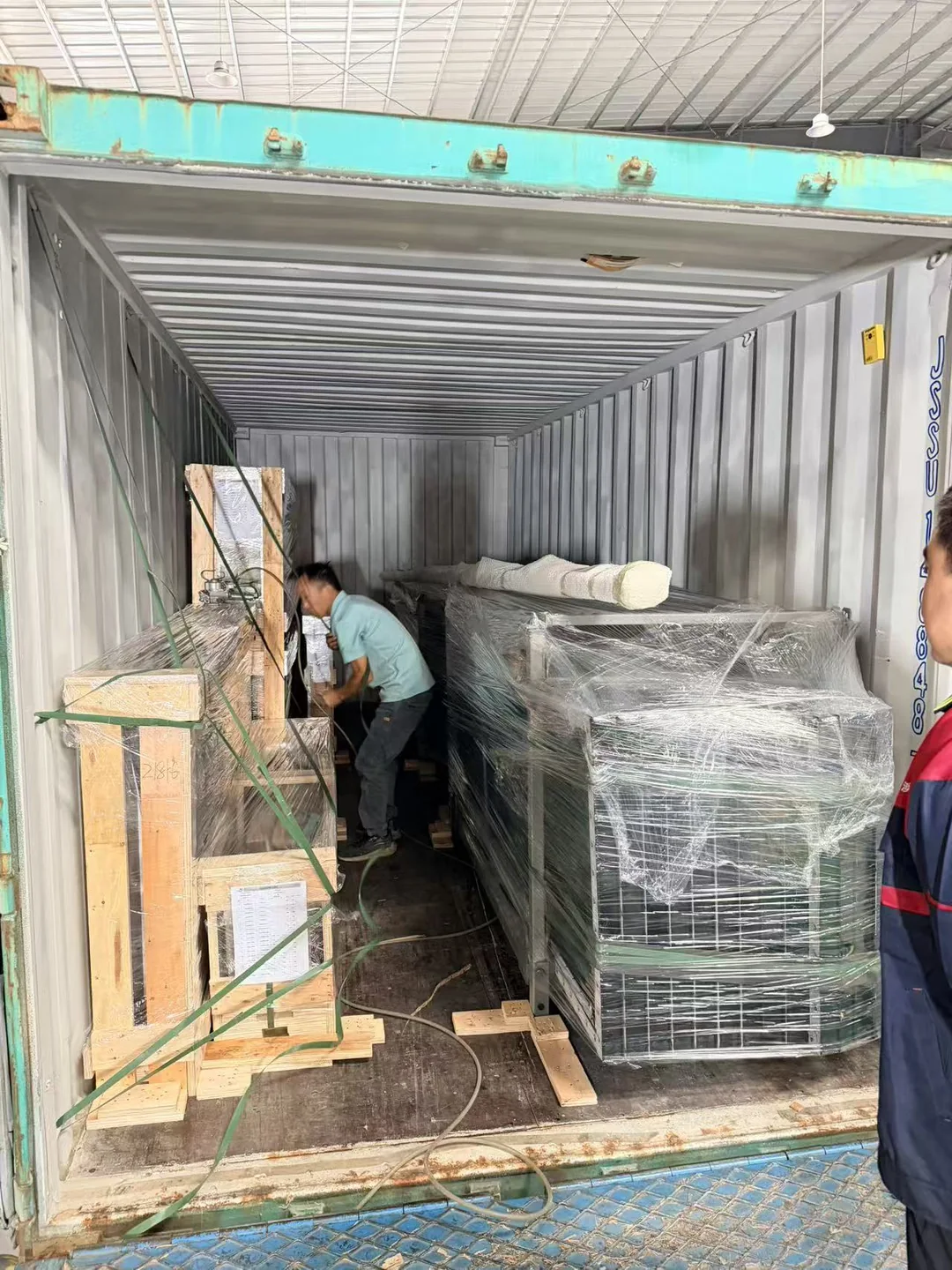 Packed façade units being loaded into a shipping container
