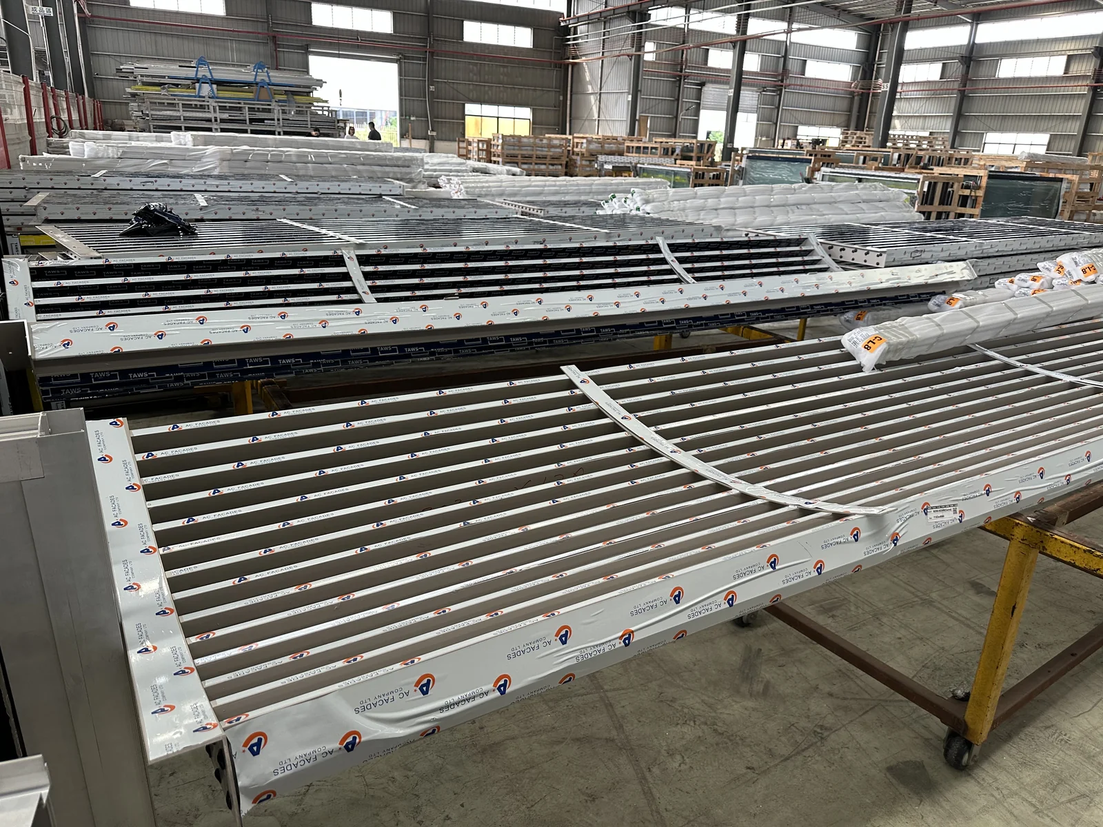 Screen assemblies laid out on the factory floor